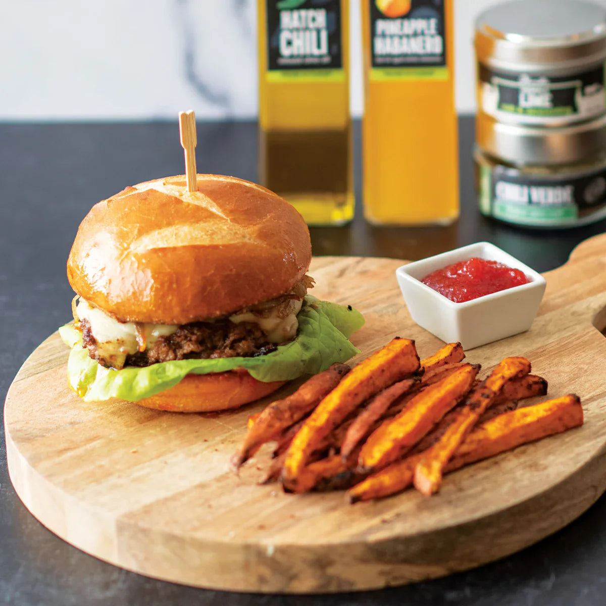 Green Chile Burger with Red Pepper Jam and Caramelized Onions with Chili Lime Sweet Potato Fries